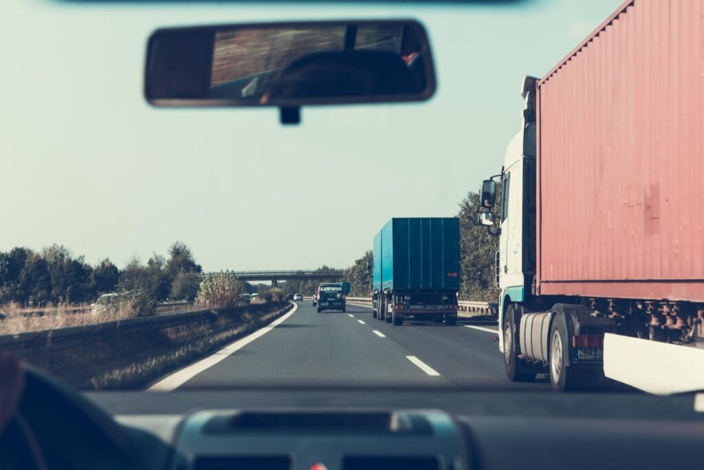 pexels-photo-172074-172074 View through rearview mirror of trucks on a German highway, driving towards Bamberg.